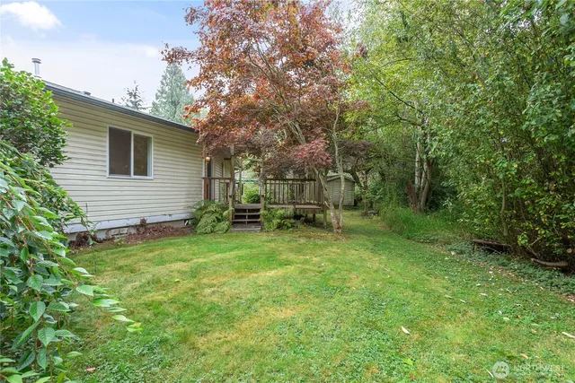 a view of backyard with a garden and entertaining space