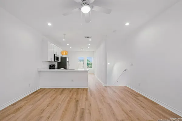 a view of kitchen and wooden floor