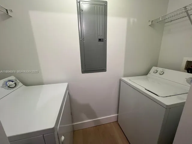 a utility room with dryer and washer