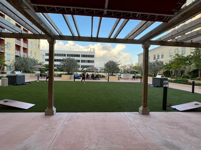 a view of a house with backyard and porch
