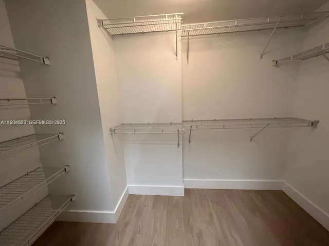 a view of a room with racks on the wall