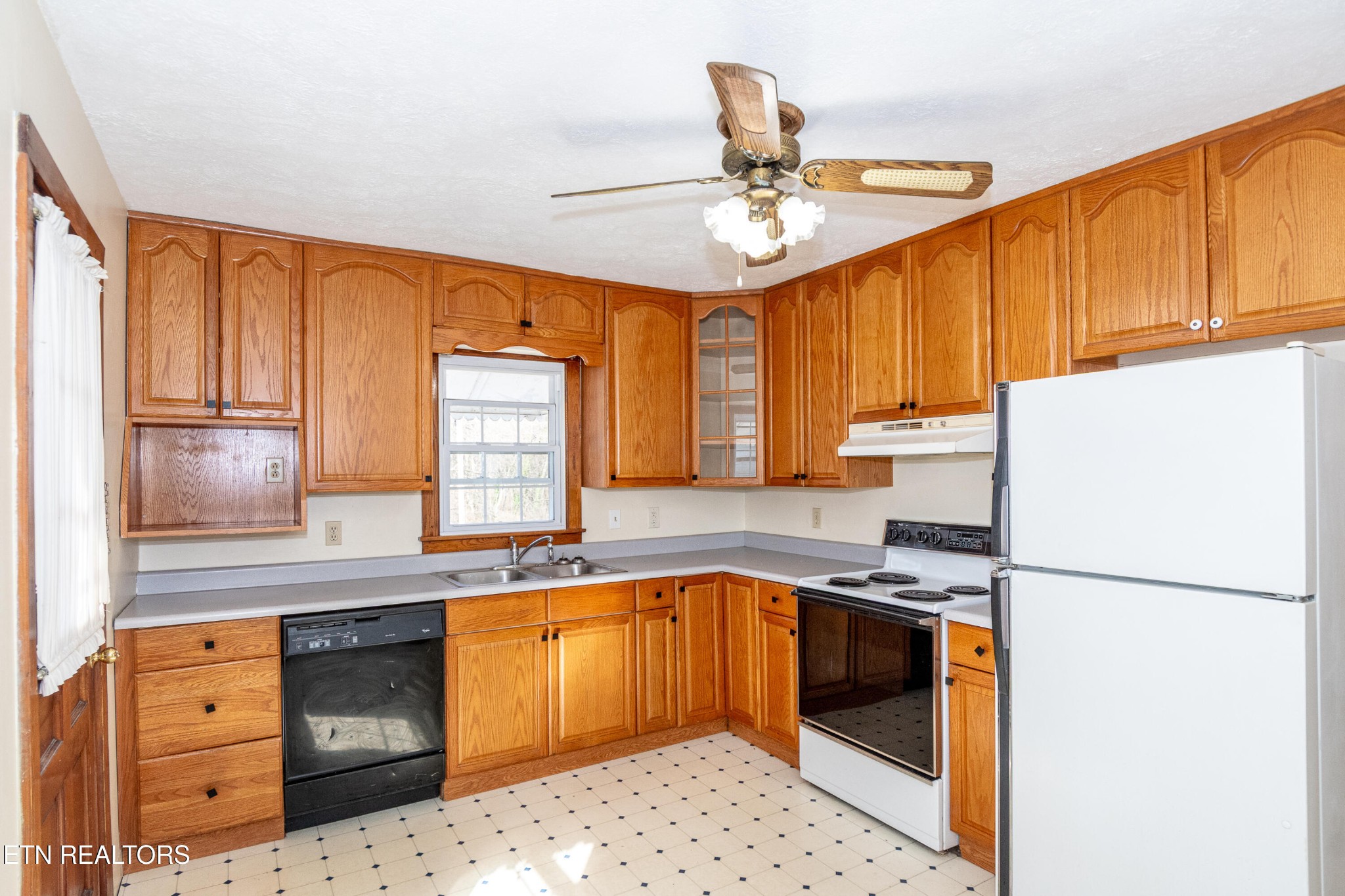 471 East Lincoln Road Alcoa, TN 37701 - Photo 11 of 47 a kitchen with stainless steel appliances granite countertop a sink a stove cabinets counter space and a window