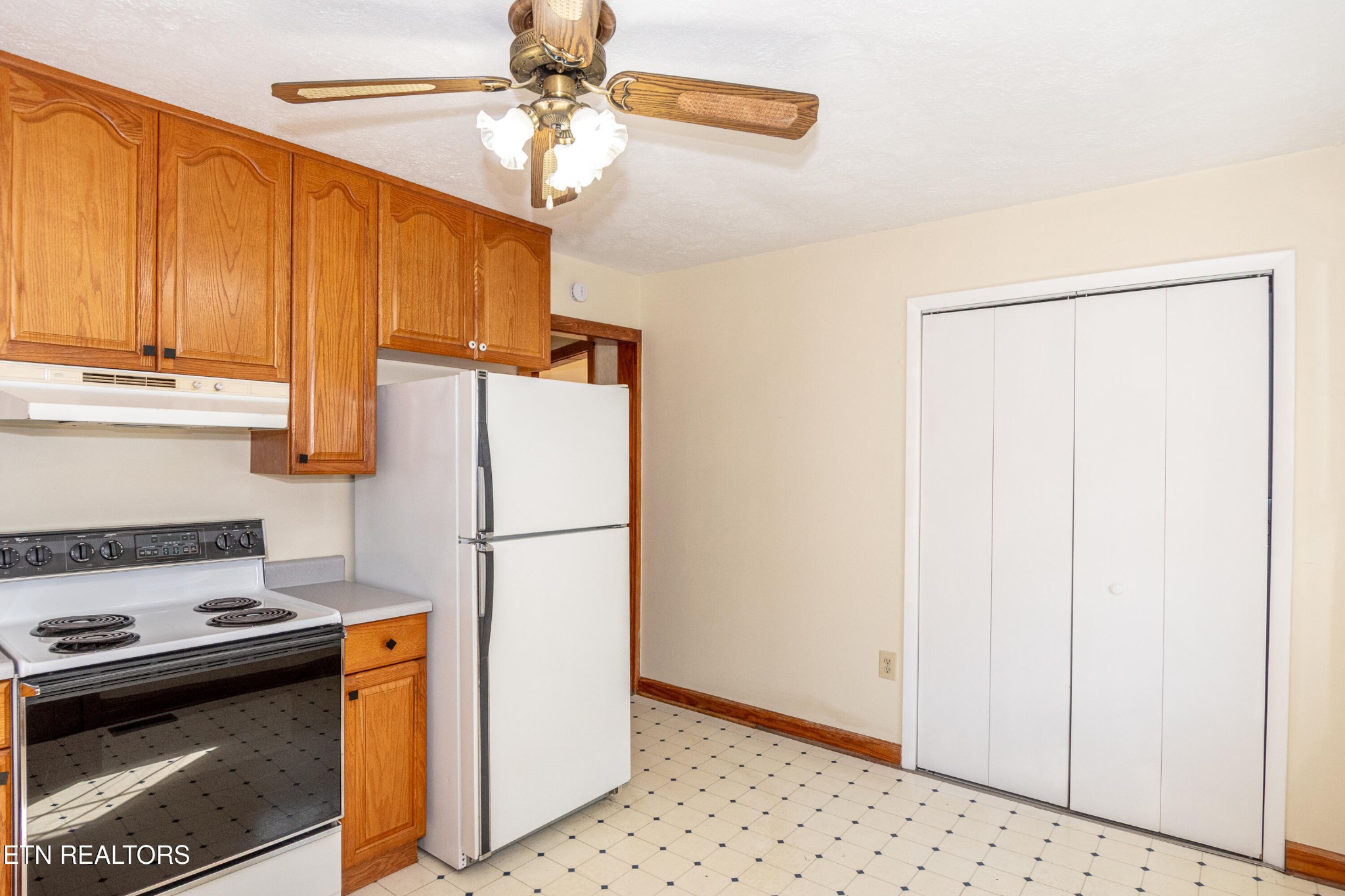 471 East Lincoln Road Alcoa, TN 37701 - Photo 14 of 47 a white refrigerator freezer and a stove sitting inside of a kitchen