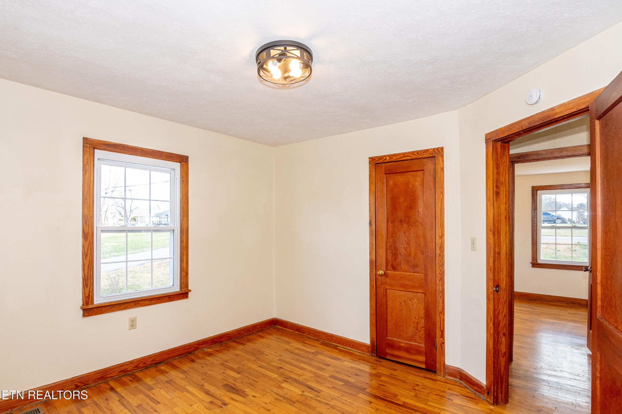 471 East Lincoln Road Alcoa, TN 37701 - Photo 16 of 47 a view of an empty room with wooden floor and a window