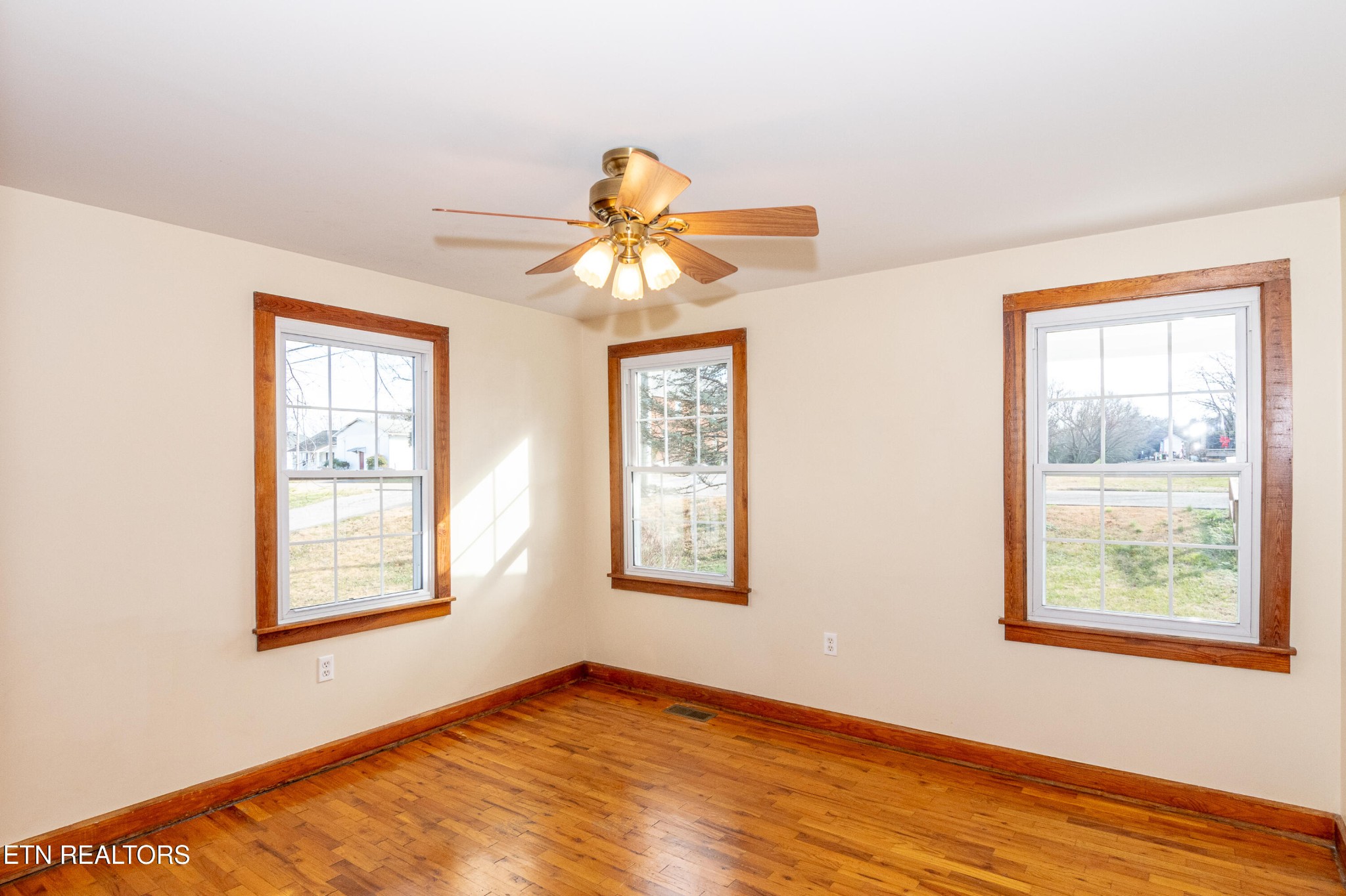 471 East Lincoln Road Alcoa, TN 37701 - Photo 19 of 47 a view of an empty room with window and wooden floor