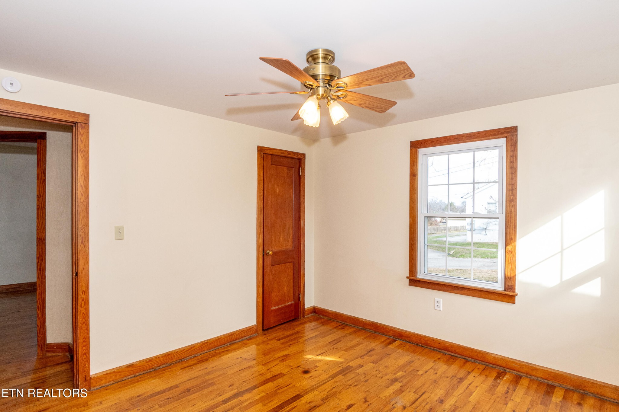 471 East Lincoln Road Alcoa, TN 37701 - Photo 21 of 47 a view of an empty room with window and wooden floor