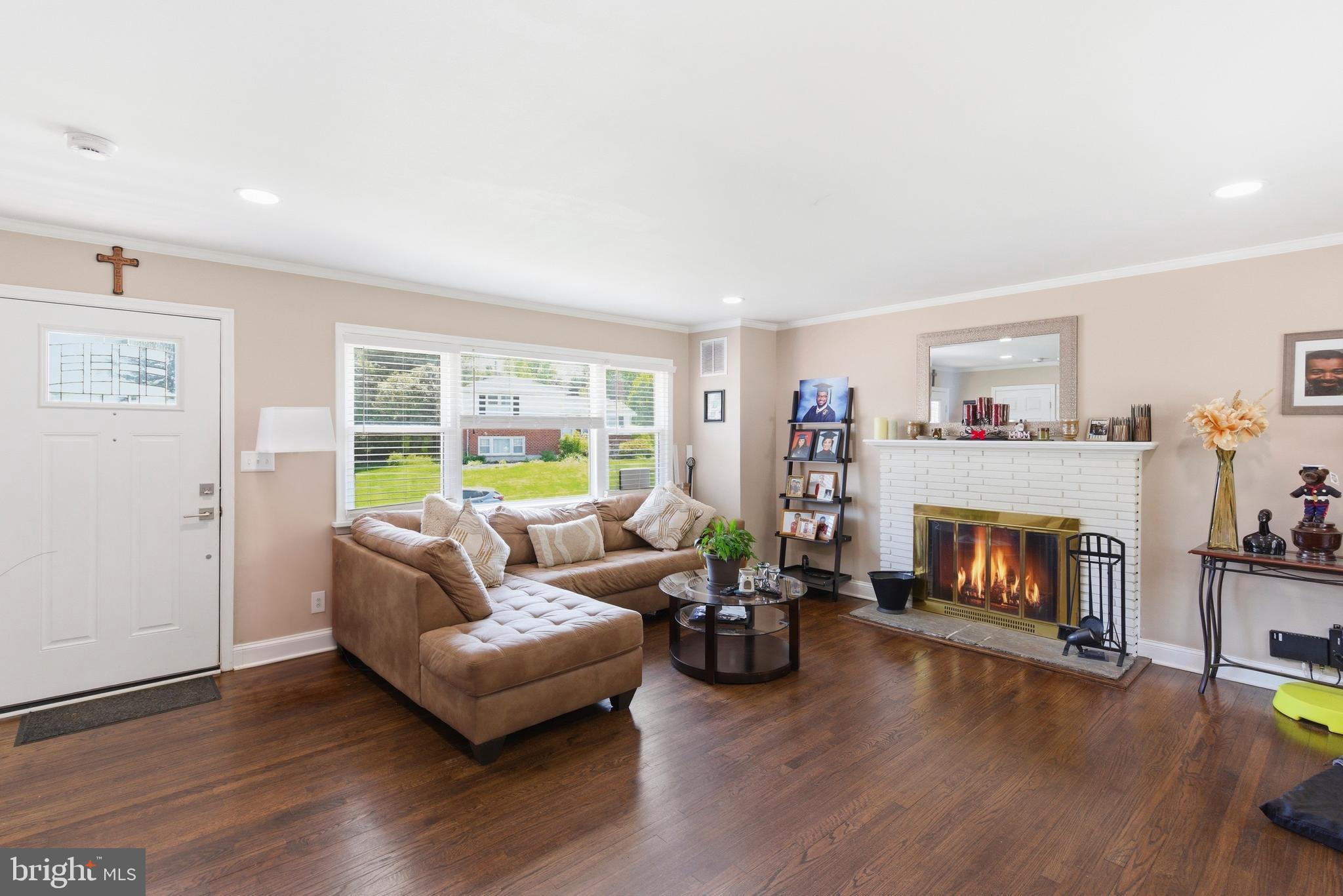 912 Shelley Road Towson, MD 21286 - Photo 5 of 27 a living room with furniture and a fireplace