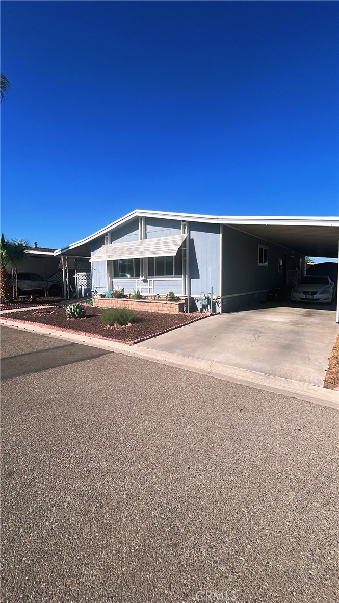 a view of building with car parked