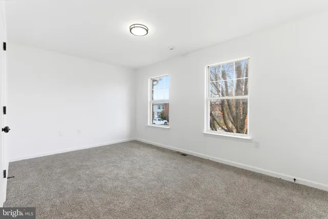 an empty room with windows