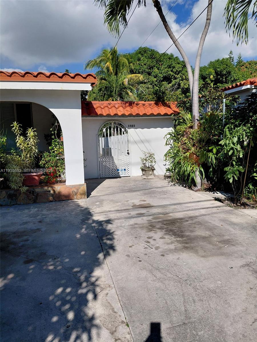 3503 Southwest 24th Street, Unit 3503 Miami, FL 33145 - Photo 1 of 12 a front view of a house with a garage