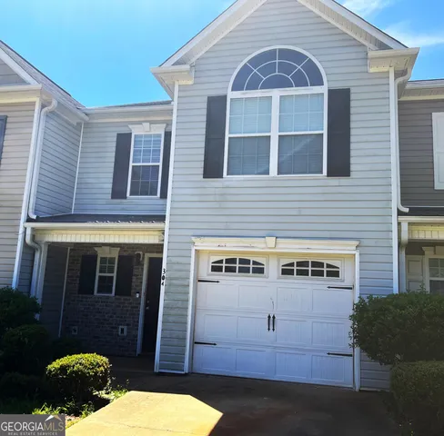 a view of front of house with a yard