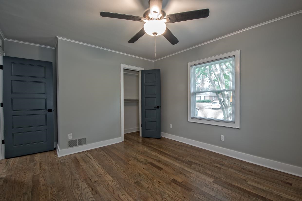 4582 Boyce Road Memphis, TN 38117 - Photo 16 of 22 wooden floor in an empty room with a window