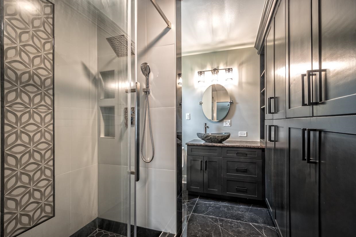 4582 Boyce Road Memphis, TN 38117 - Photo 7 of 22 a bathroom with a mirror a sink and a mirror