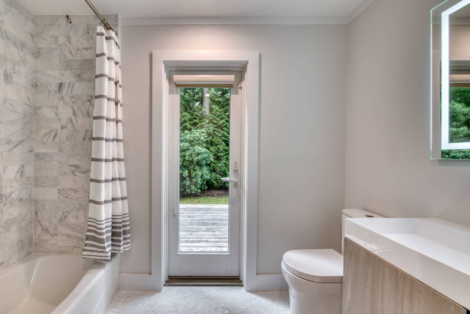 3 Short Lane East Hampton, NY 11937 - Photo 11 of 13 a bathroom with a toilet a sink and a window