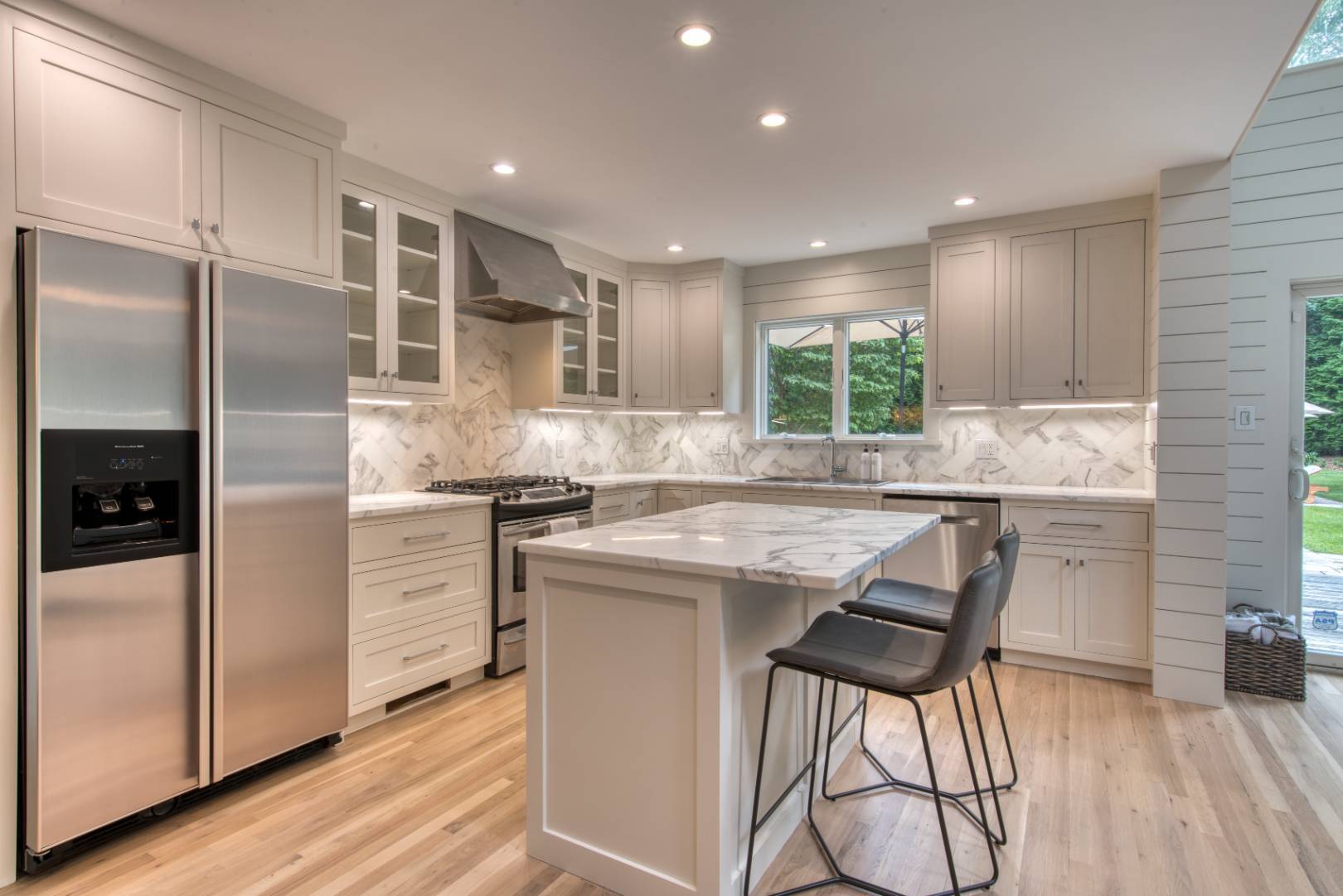 3 Short Lane East Hampton, NY 11937 - Photo 3 of 13 a kitchen with kitchen island a large counter top space and stainless steel appliances