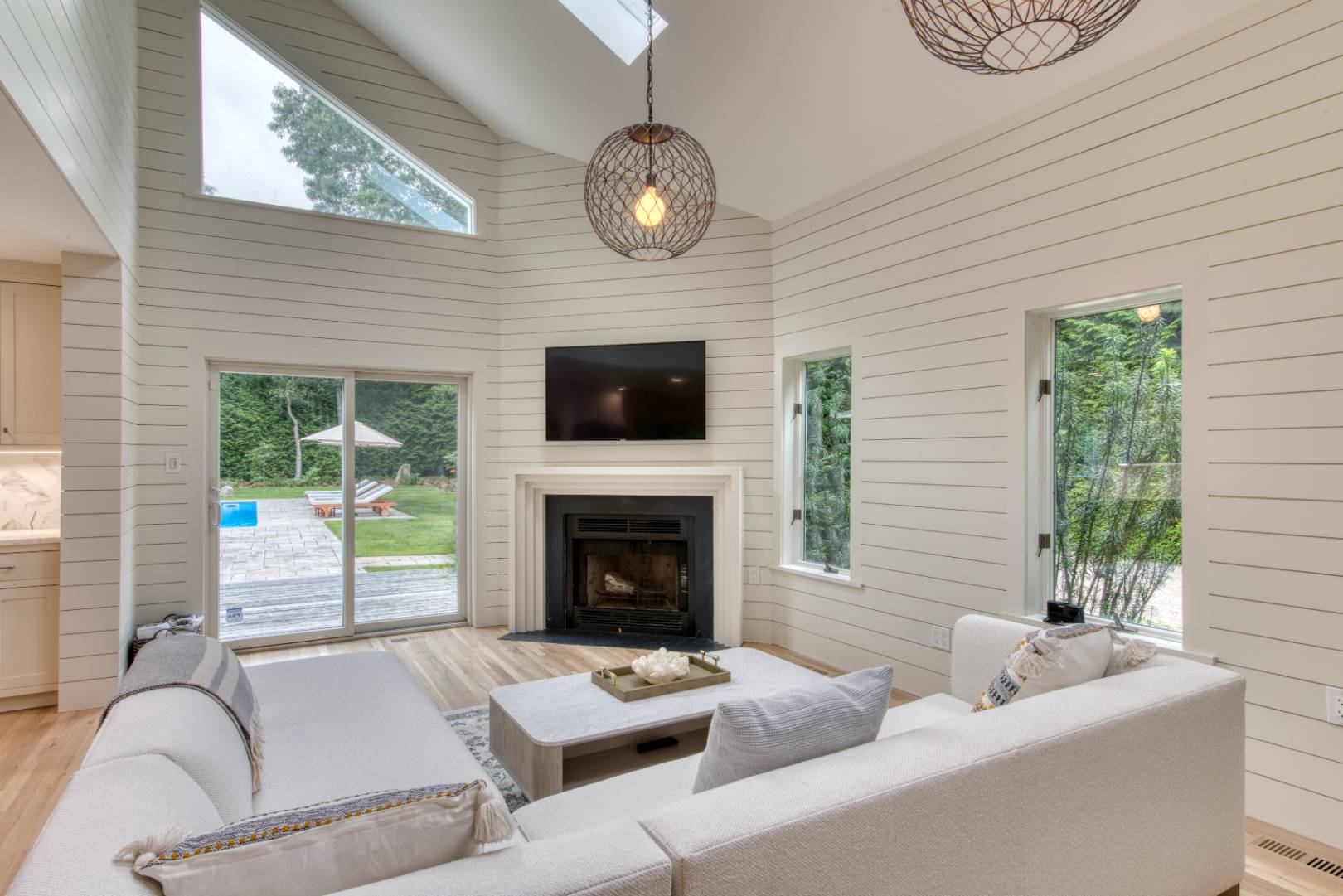 3 Short Lane East Hampton, NY 11937 - Photo 4 of 13 a living room with furniture a window and a fireplace