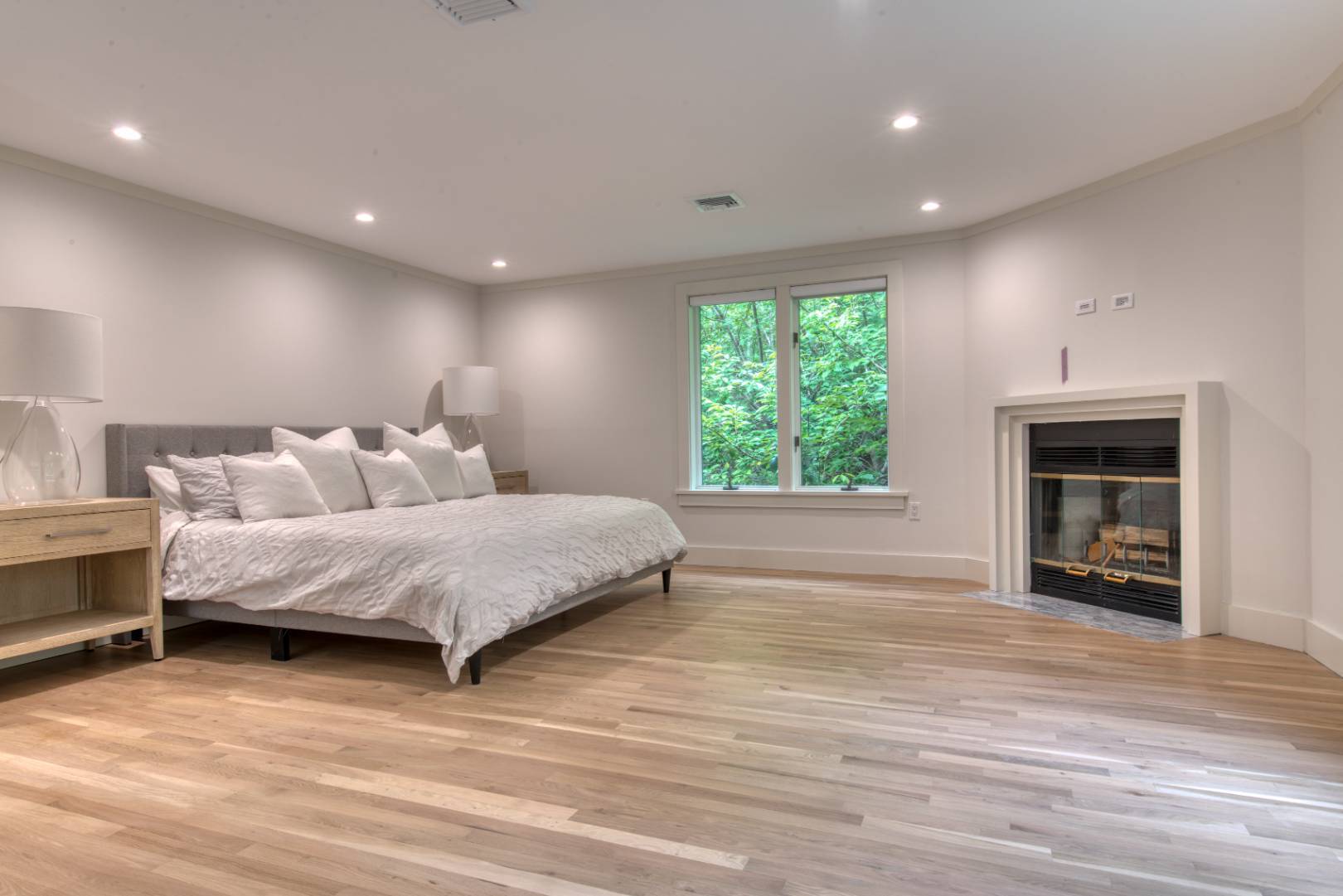 3 Short Lane East Hampton, NY 11937 - Photo 5 of 13 a spacious bedroom with a bed and a large window