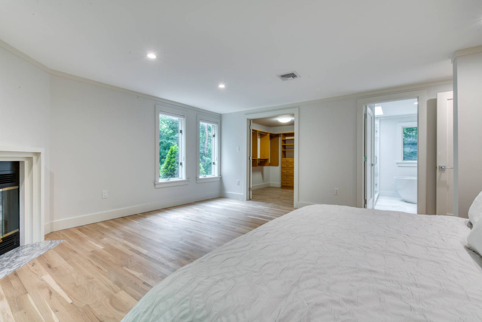 3 Short Lane East Hampton, NY 11937 - Photo 6 of 13 a view of an empty room with window and wooden floor