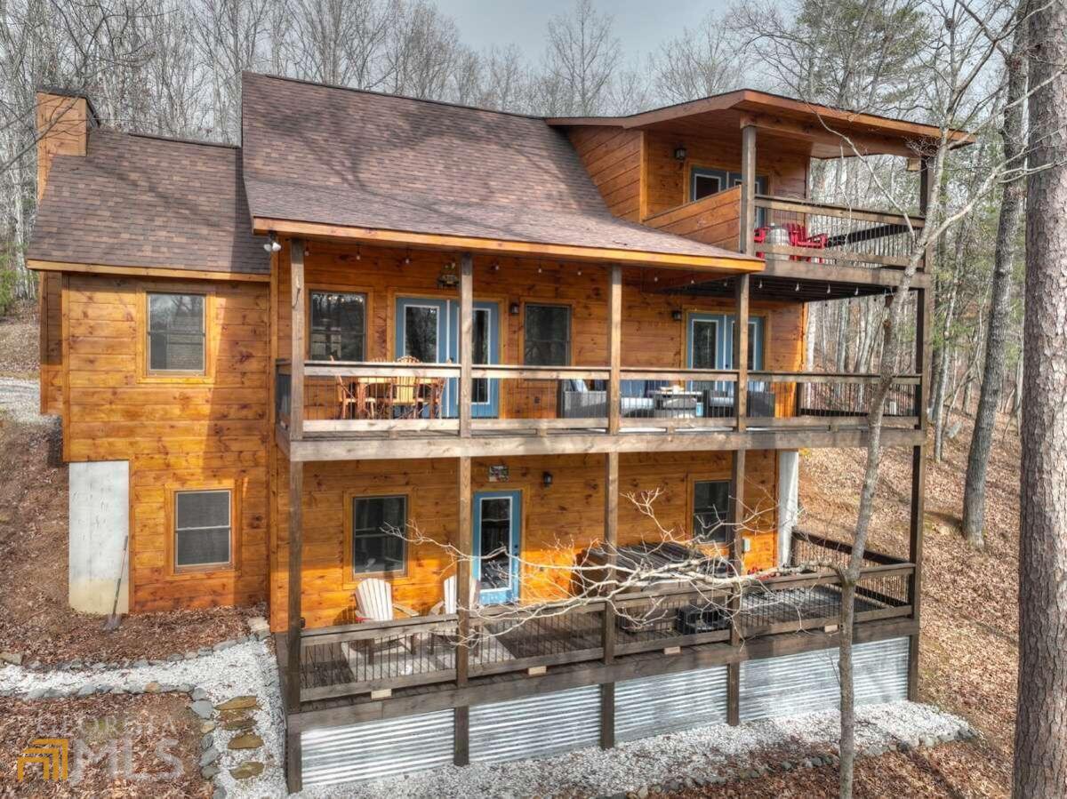 86 Windy Valley Lane, Unit 22 Blue Ridge, GA 30513 - Photo 1 of 1 a front view of a building with multiple windows