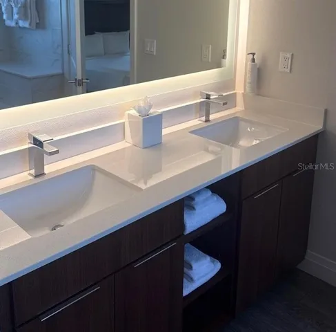 a bathroom with a sink and a mirror
