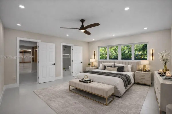 a bathroom with a shower and a sink mirror