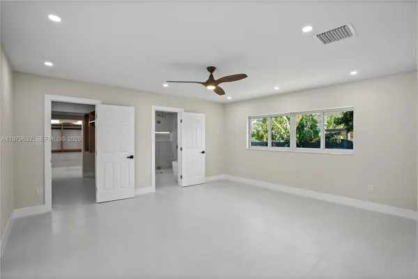 a bathroom with a double vanity sink mirror and shower