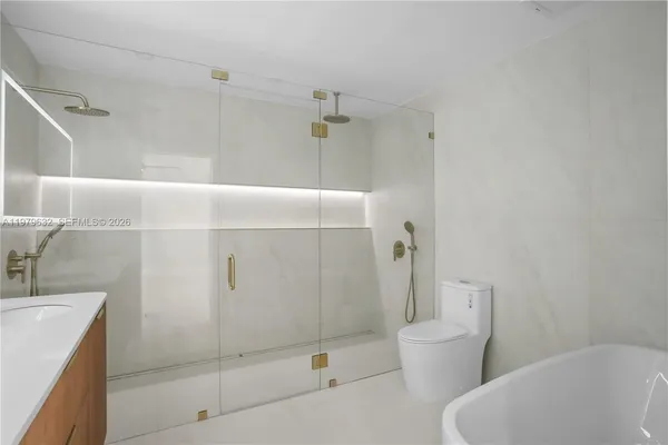 a bathroom with a shower and a tub