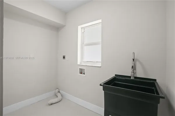 a living room with a fireplace and a flat screen tv