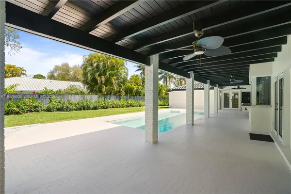 an aerial view of residential houses with outdoor space and street view