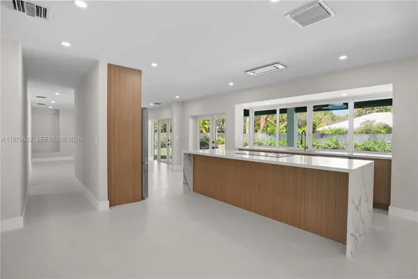 a kitchen with stainless steel appliances a refrigerator and a stove