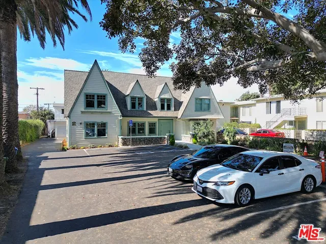 a front view of a house with parking space