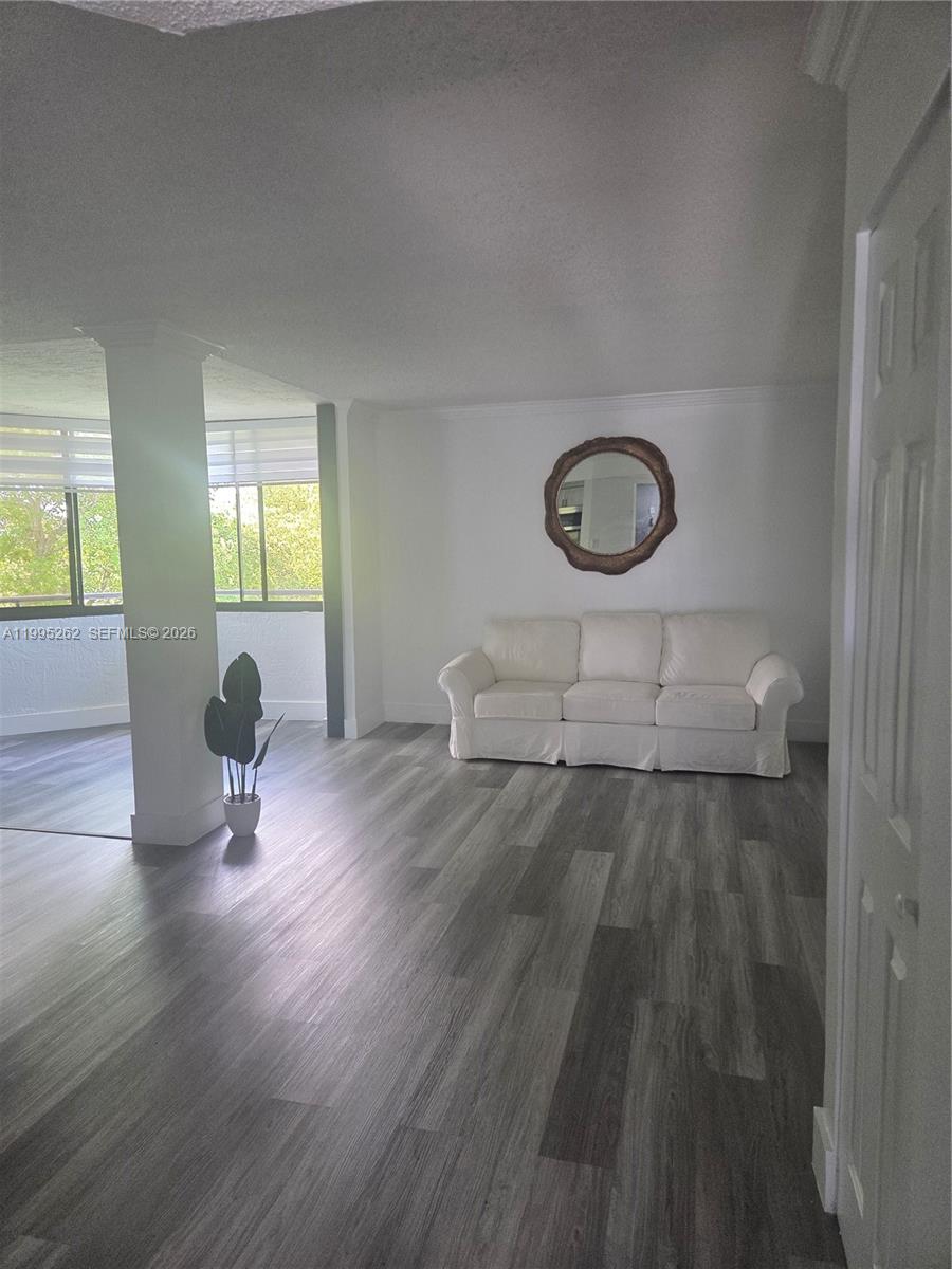 8365 Southwest 152nd Avenue, Unit 3 Miami, FL 33193 - Photo 1 of 25 a living room with furniture and a wooden floor