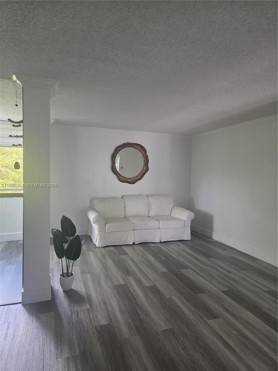 8365 Southwest 152nd Avenue, Unit 3 Miami, FL 33193 - Photo 17 of 25 a living room with wooden floor