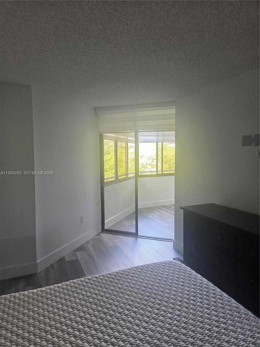 8365 Southwest 152nd Avenue, Unit 3 Miami, FL 33193 - Photo 18 of 25 a view of an empty room and window