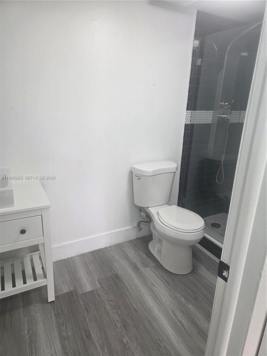 8365 Southwest 152nd Avenue, Unit 3 Miami, FL 33193 - Photo 22 of 25 a white toilet sitting next to a sink
