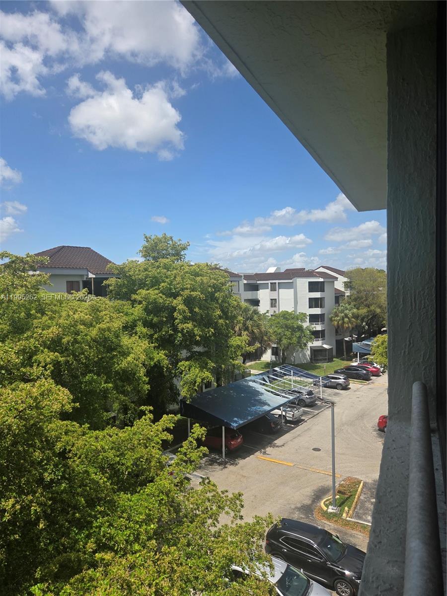 8365 Southwest 152nd Avenue, Unit 3 Miami, FL 33193 - Photo 25 of 25 a view of a terrace with wooden floor and a yard