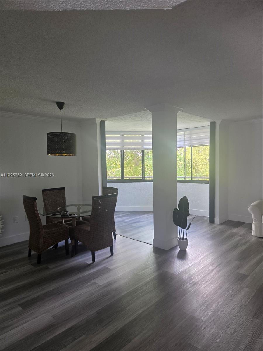 8365 Southwest 152nd Avenue, Unit 3 Miami, FL 33193 - Photo 6 of 25 a living room with furniture and wooden floor