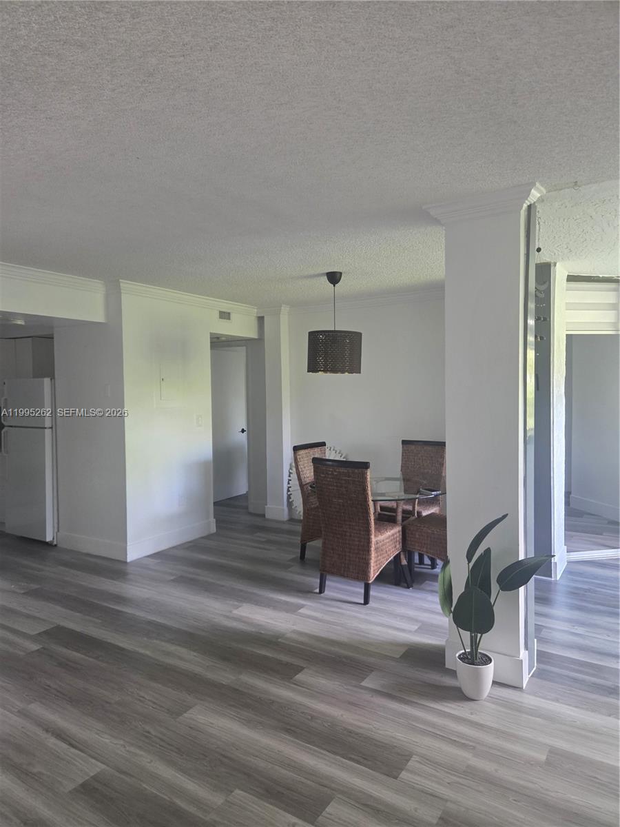 8365 Southwest 152nd Avenue, Unit 3 Miami, FL 33193 - Photo 8 of 25 a view of a livingroom with furniture and a potted plant
