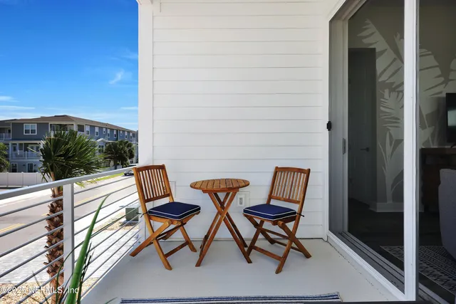 a view of chairs in the balcony