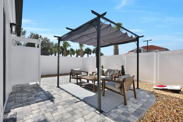 a patio with table and chairs