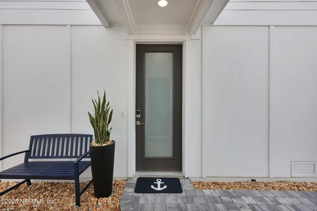 a potted plant sitting on a shelf with potted plants on wooden floor