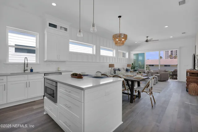 a kitchen with a sink stove and cabinets