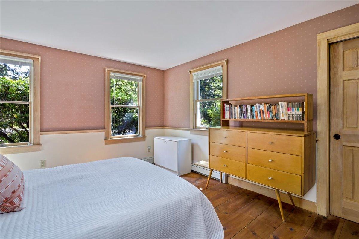 45 Danielle Drive Eastham, MA 02642 - Photo 18 of 42 a bedroom with a bed and a dresser next to a window