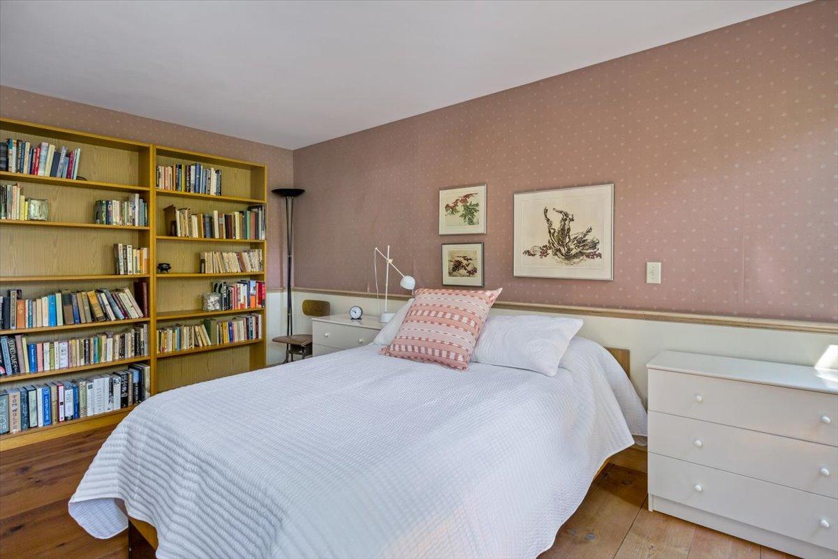 45 Danielle Drive Eastham, MA 02642 - Photo 19 of 42 a bedroom with a bed and a book shelf