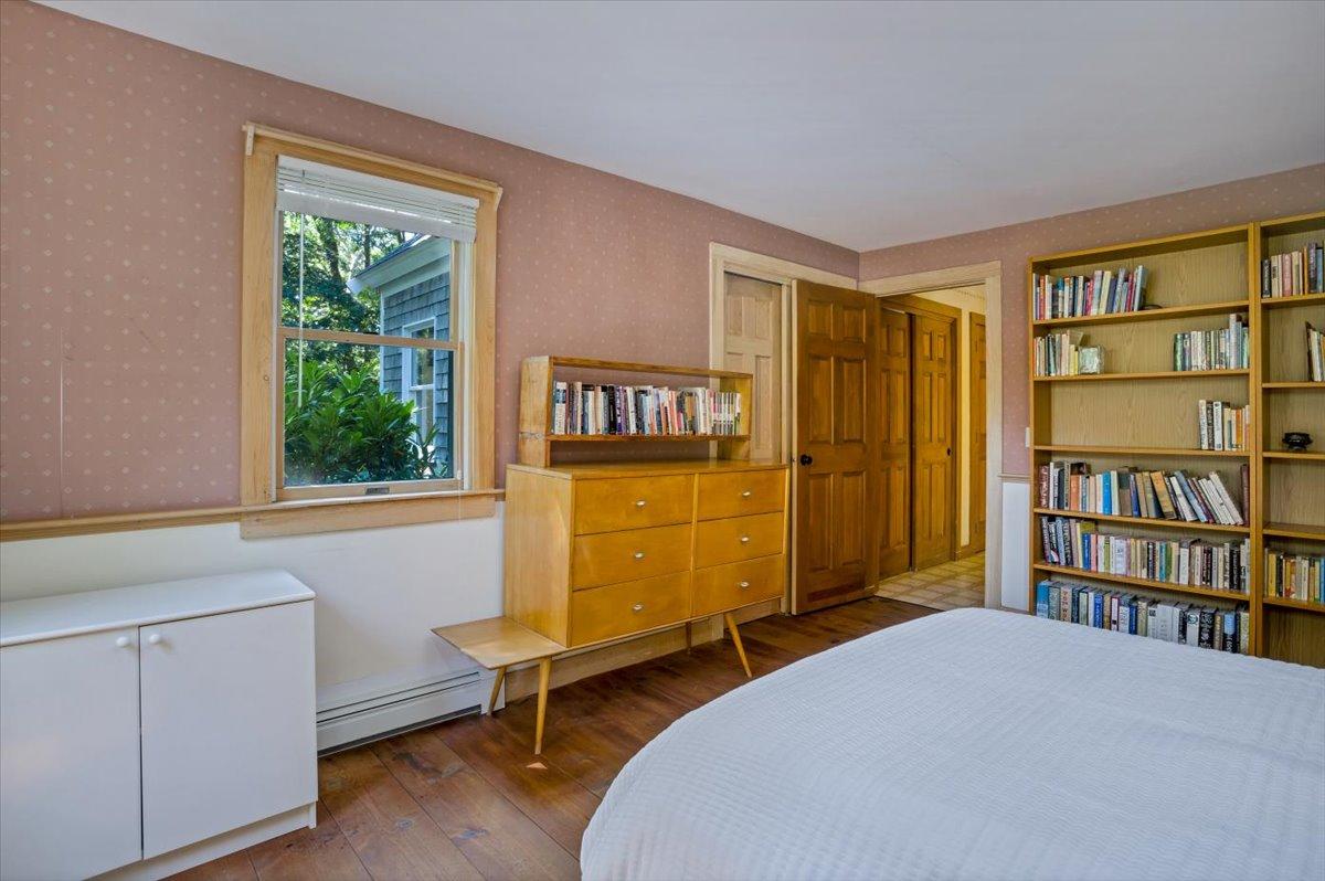 45 Danielle Drive Eastham, MA 02642 - Photo 20 of 42 a bedroom with a bed and a bookshelf