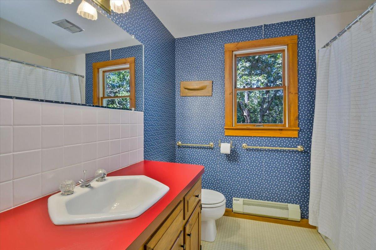 45 Danielle Drive Eastham, MA 02642 - Photo 29 of 42 a bathroom with a sink a mirror and a toilet