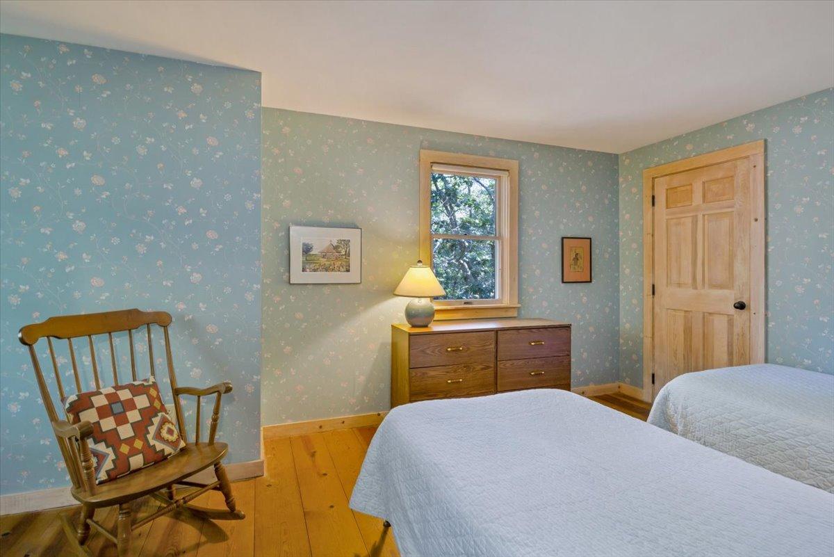 45 Danielle Drive Eastham, MA 02642 - Photo 30 of 42 a bedroom with a bed and wooden floor