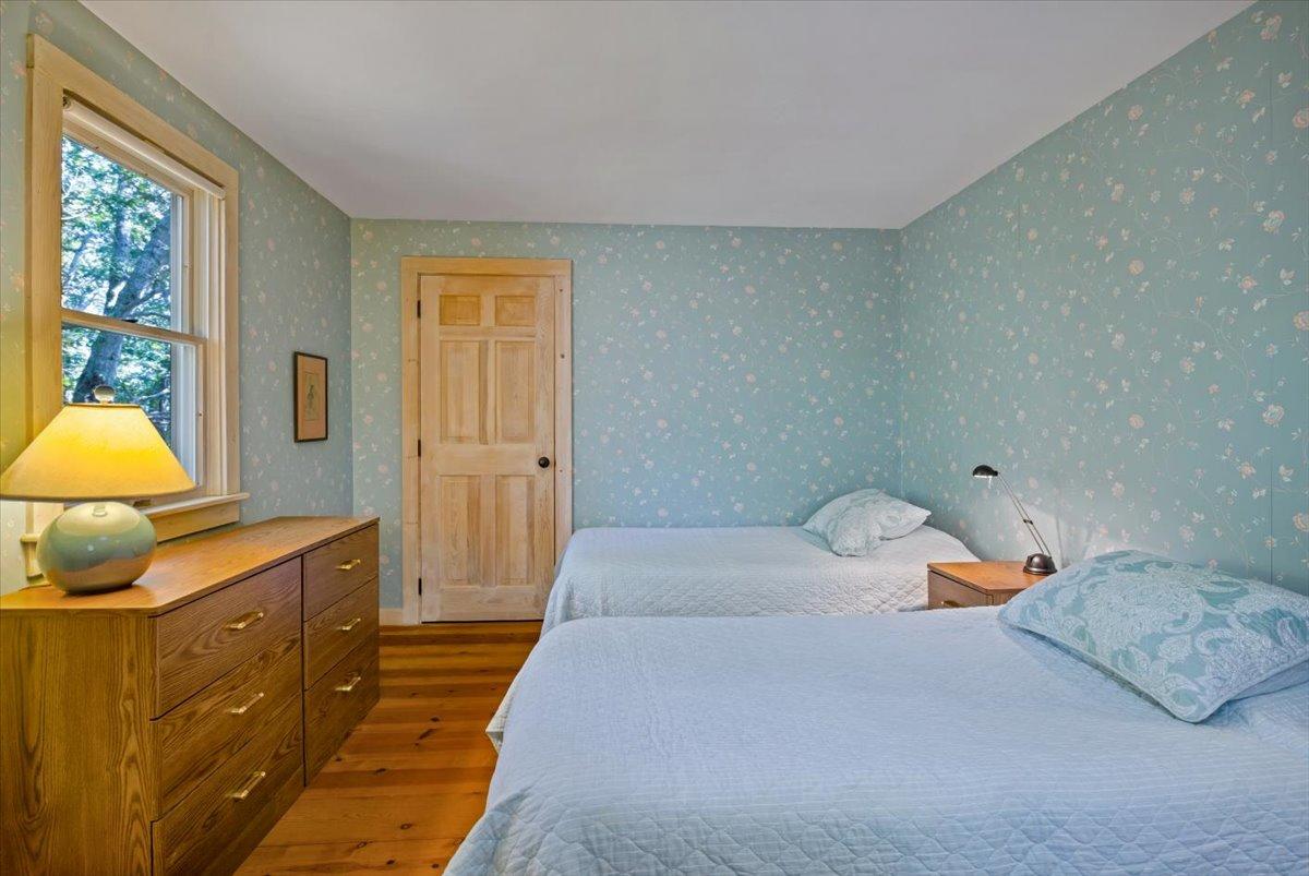 45 Danielle Drive Eastham, MA 02642 - Photo 32 of 42 a bedroom with a bed and a lamp on dresser
