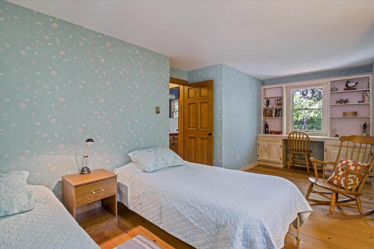 45 Danielle Drive Eastham, MA 02642 - Photo 33 of 42 a bedroom with a bed and wooden floor