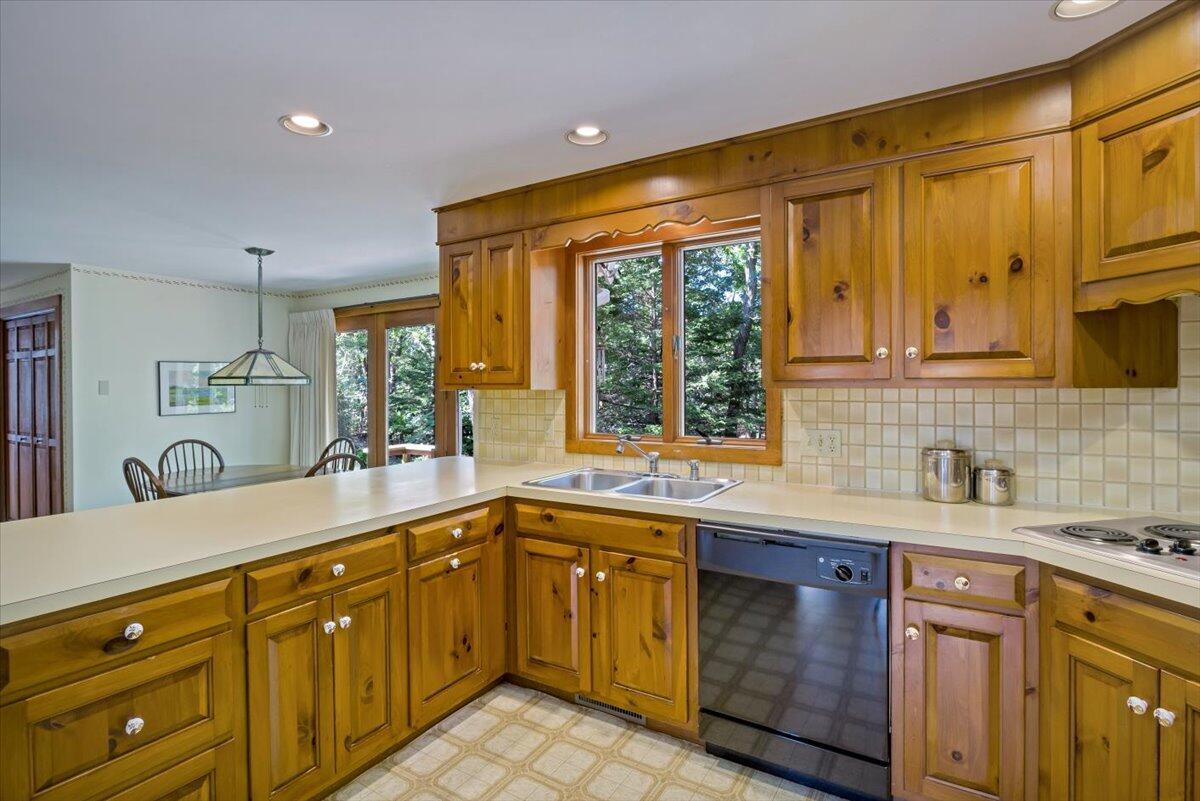 45 Danielle Drive Eastham, MA 02642 - Photo 5 of 42 a kitchen with a sink stove and cabinets